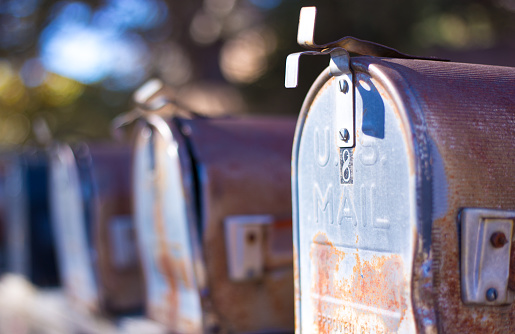 Line of Classic Rusty Old Rural US Mailboxes. Shot in Santa Fe, NM.