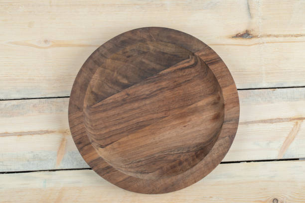 istock Carved wooden platters with pieces on them 1304444889