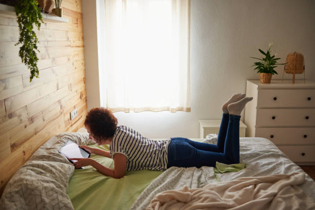 istock Woman watch on digital tablet computer at home 1304445171