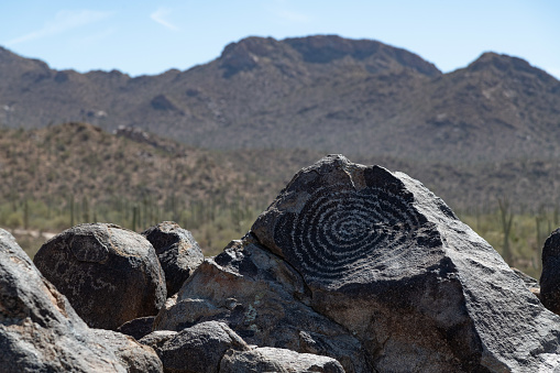 Prehistoric rock carvings or petroglyphs on Signal Hill hiking trail in National park.