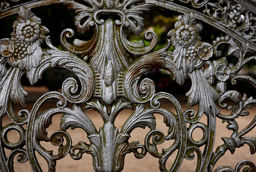 Element of stunning curved wrought iron bench at at the park in Santiago de Compostela, Spain