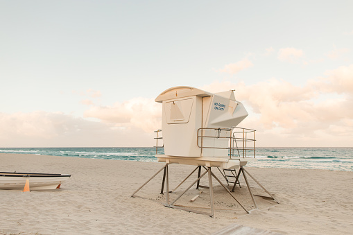 Teal ocean waves sweeping ashore on Palm Beach, Florida.