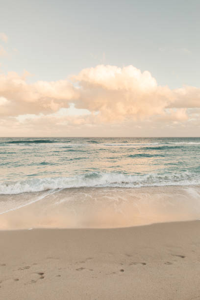 Teal ocean waves sweeping ashore on Palm Beach, Florida.