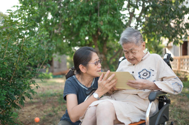 istock Senior woman talks with a doctor online 1304459231