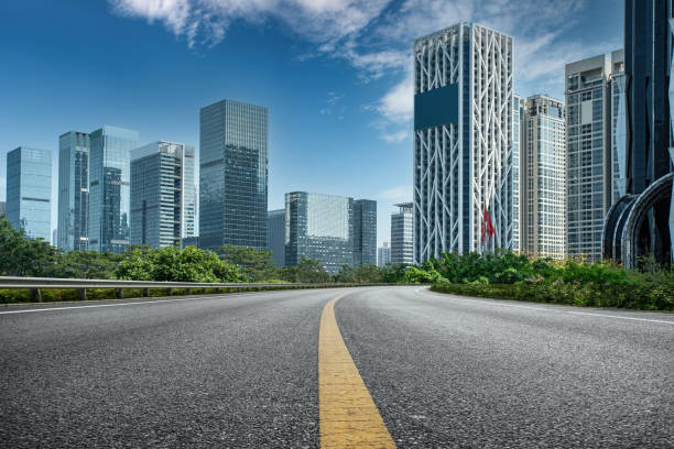 istock Urban road ground and urban buildings 1304461621