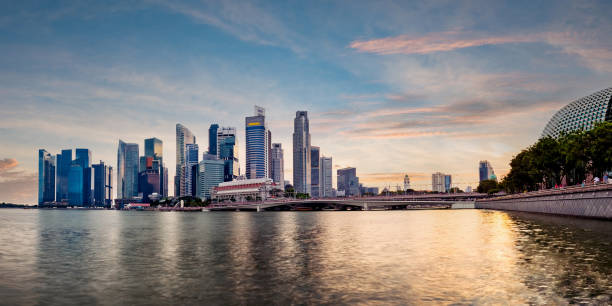 istock Singapore business district skyline during sunset. 1304467406