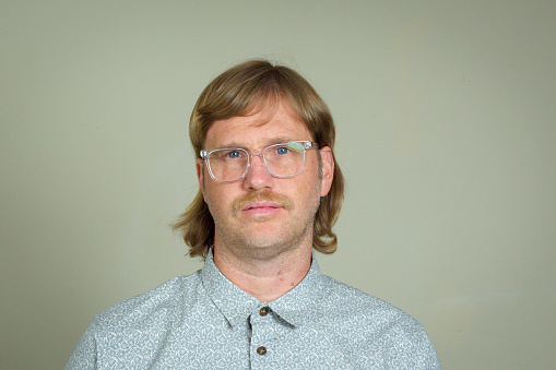 Man with mullet and glasses
