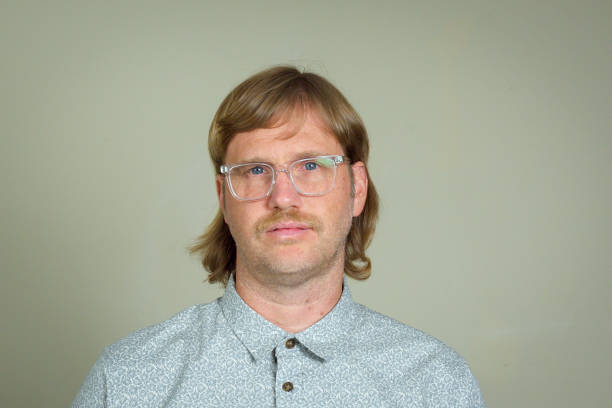 Mullet Man with mullet and glasses men hair cut stock pictures, royalty-free photos & images