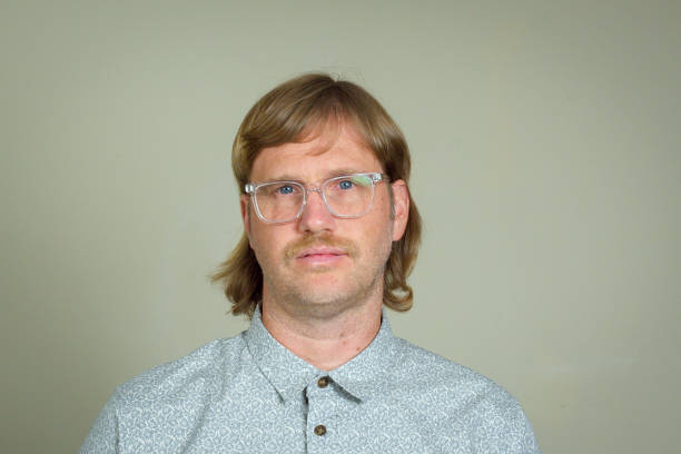 Mullet Man with mullet and glasses vintage hairstyle stock pictures, royalty-free photos & images