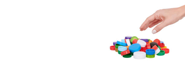 istock Hand with plastic lids, isolated on white background. 1304475999