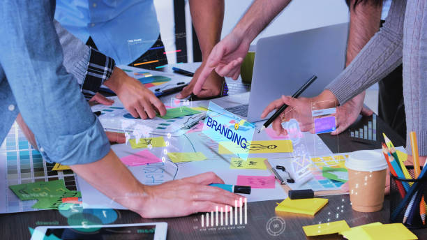 istock Close up creative designer use augmented reality app brainstorming about branding on desk at modern office.Creative digital development agency 1304476678