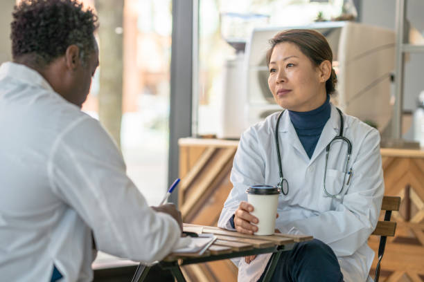 istock Doctors Chatting Together Stock Photo 1304484922