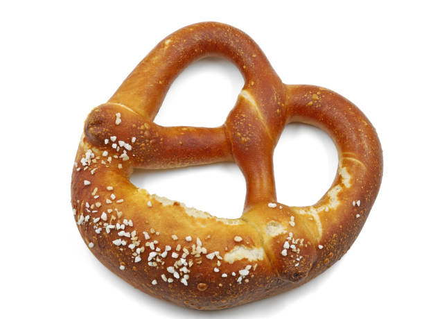 istock freshly baked pretzel isolated on white background, top view 1304484941
