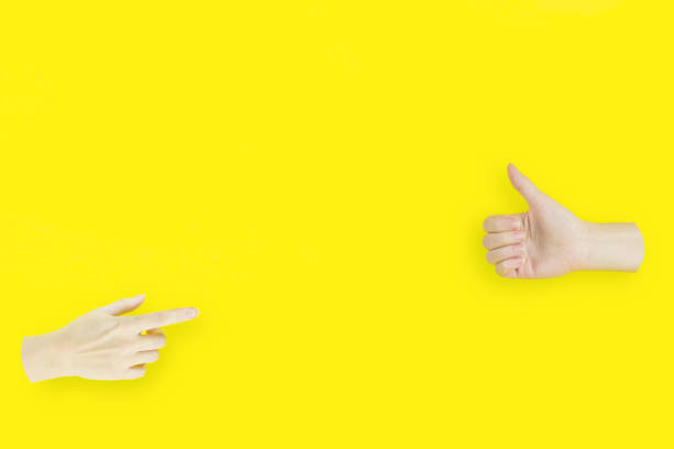 istock Two hands, one with the index finger pointing on Hand Showing Thumb Up Sign. 1304485756