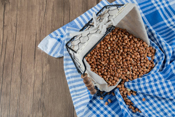 istock Raw brown kidney beans on a wooden table 1304485810
