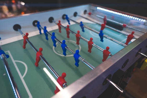 istock Table football game with red and blue players. 1304486578