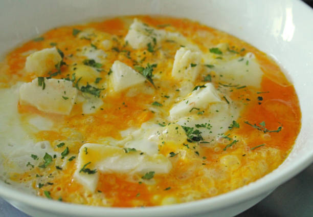 istock Cooking omelet with cheese and herbs 1304487250