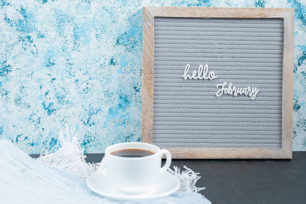 istock Hello month names on the board with a cup of drink around 1304487547