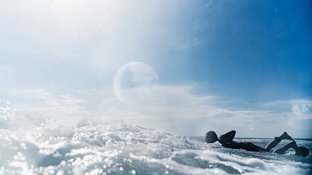 istock Young man is waiting for a wave for surfing. 1304487858