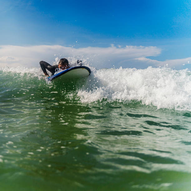 istock Young man learning how to ride surfing 1304487875