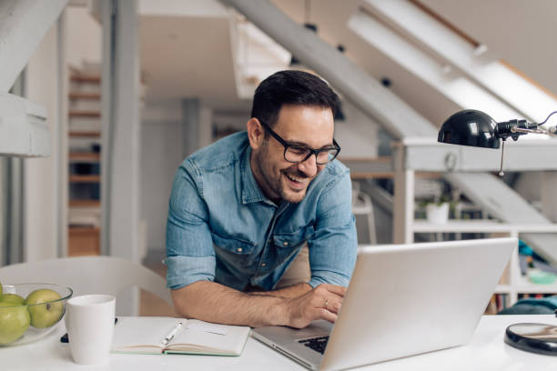 istock Young businessman enjoying a work from home 1304488022