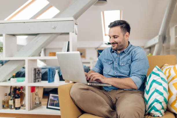 istock Young businessman working on the web from his living room 1304488077