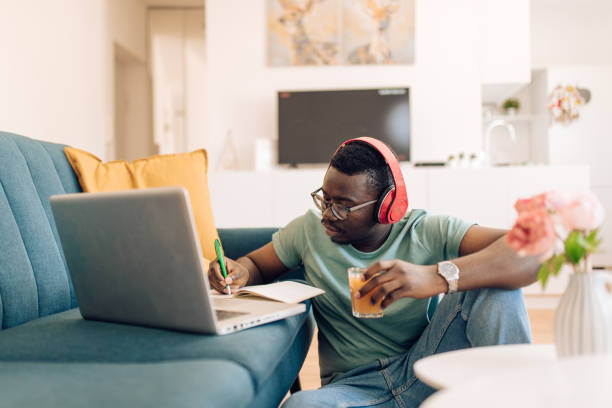 istock African-American freelancer working and refreshing with juice 1304488257