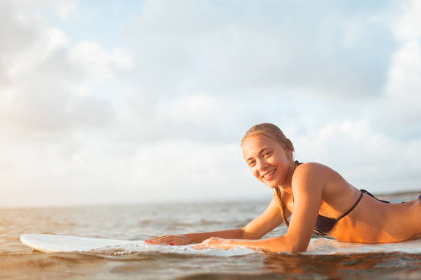 istock young surfer woman 1304488924