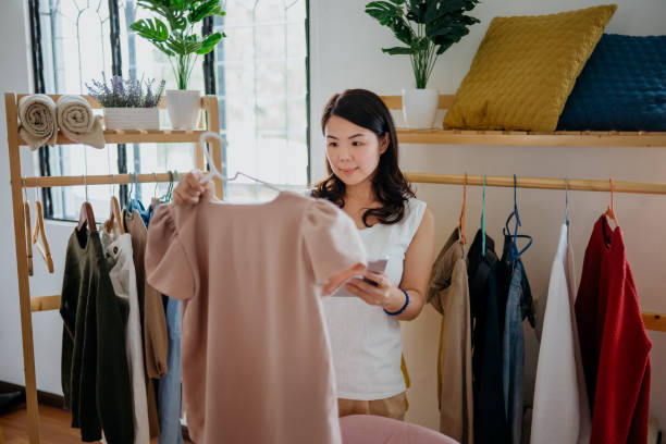 istock Small business owner selling clothes online using digital tablet 1304492261