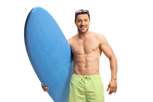 Man holding a surfing board and smiling isolated on white background