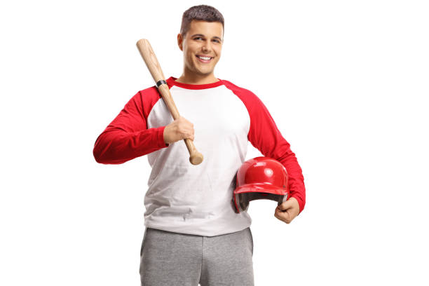 istock Handsome young man with a baseball bat and red helmet 1304493137