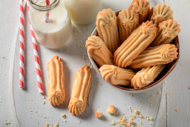 istock Tasty shortbread cookies served with milk and straw 1304494264