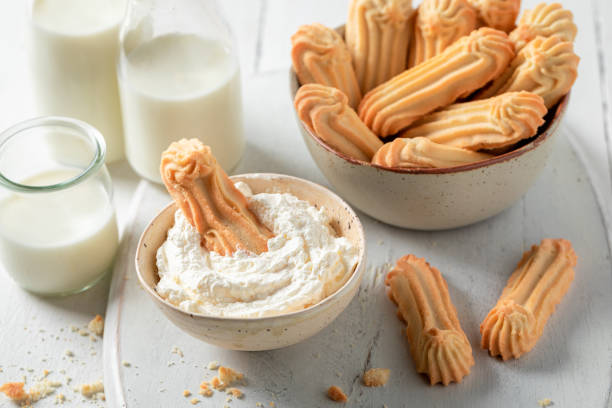 istock Tasty shortbread cookies served with whipped cream 1304494814