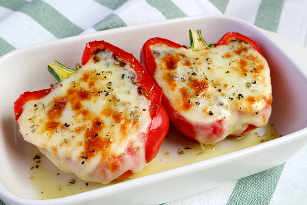 istock Fresh Cooked Delectable Homemade Stuffed Bell Peppers with Melting Cheese 1304495504
