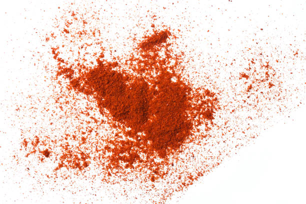 istock Paprika powder pile isolated on white background, top view 1304495567
