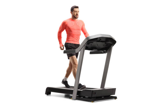 istock Fit young man in sportswear walking on a treadmill 1304496706