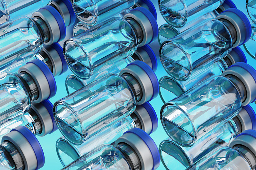 Lot of vaccine glass vials arranged in a rows on blue background, 3d rendering illustration.