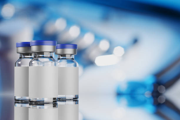 istock Vaccine glass vials on blue background, 3d rendering illustration. 1304500038