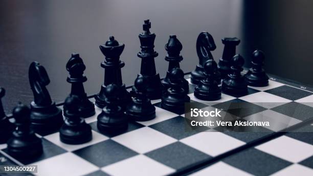 Spaced Chess On A Black Wooden Background Stock Photo - Download Image Now - Backgrounds, Belarus, Black Color