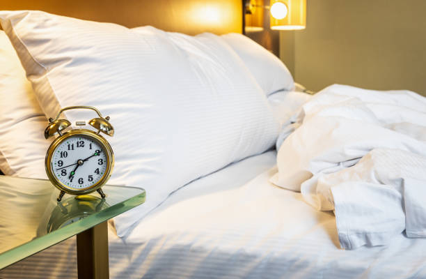 istock mechanical alarm clock is placed on the bedside table at home 1304501717
