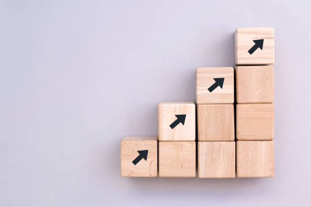 istock Business concept growth success process, Wood block stacking as step stair on paper grey background, copy space. 1304502659