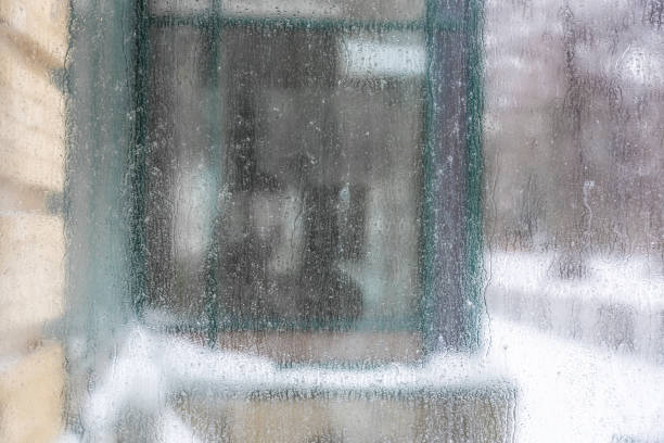 istock Dirty scratched glass with dew drops 1304504101