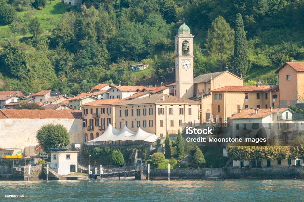 City Hall & Church Tower of Lezzeno on Lake Como, Italy City Hall & Church Tower of Lezzeno on Lake Como, Italy. The Church of Saints Quirico and Giulitta was built in the 16th century. 16th Century Stock Photo