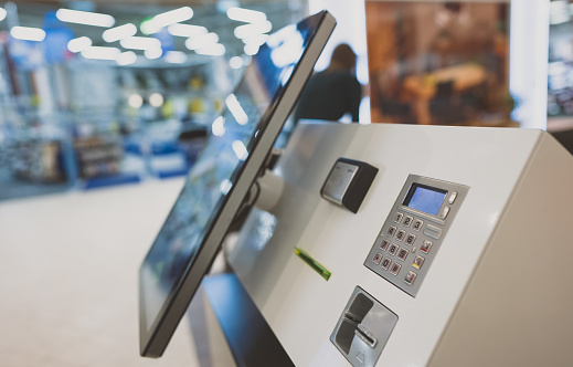 Modern self-service terminal in city mall.