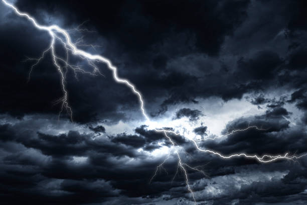 istock Lightning strike against the background of a cloudy sky. 1304509117