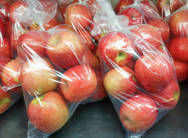 Fresh Organic Apples Are Packed In Plastic Bags Stock Photo - Download  Image Now - Plastic Bag, Apple - Fruit, Fruit - iStock
