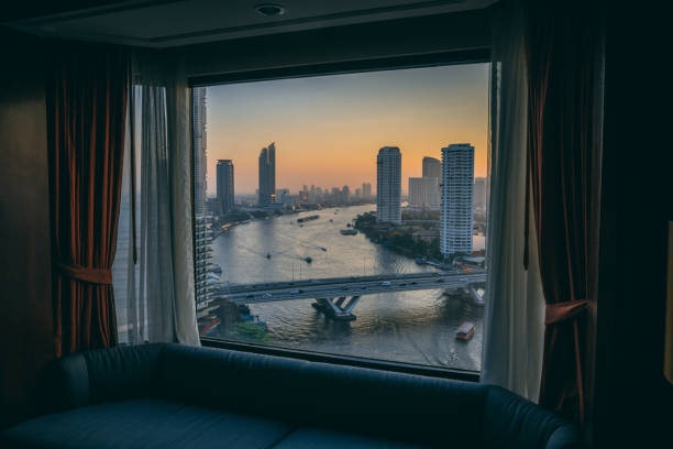 istock Bangkok Sunset over River out of Window 1304510400