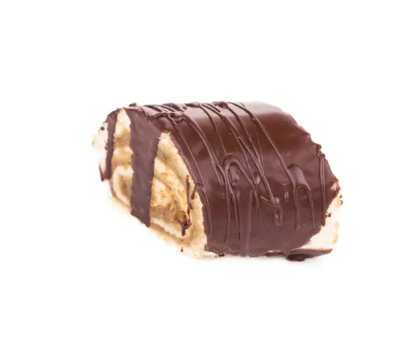 Chocolate roll with halva. Isolated over white background. Close-up.
