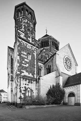 Black and white view of the catholic Herz-Jesu church in Aachen Burtscheid, Germany at night.