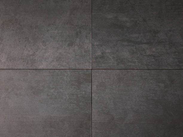 istock Gray and black color tile floor or wall background 1304514215